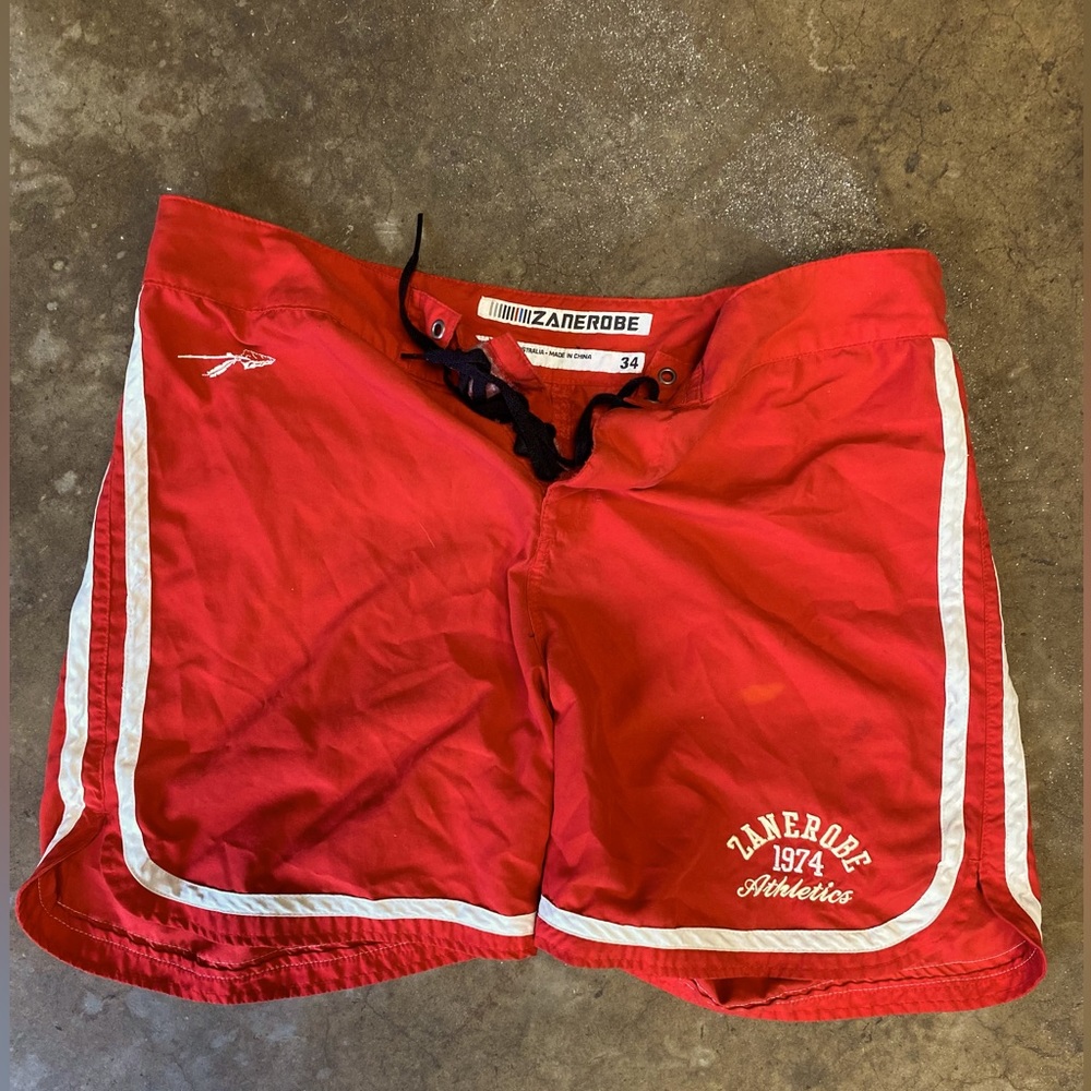 These are Australian brand Zanerobe trunks, size 34, in a standout red.
